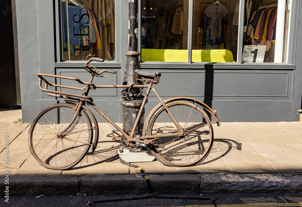 Margate, Kent, united kingdom, august 24 2022 close up on an old rusty bike with its frame completely covered with rust chained to a lampost discarded and forgotten