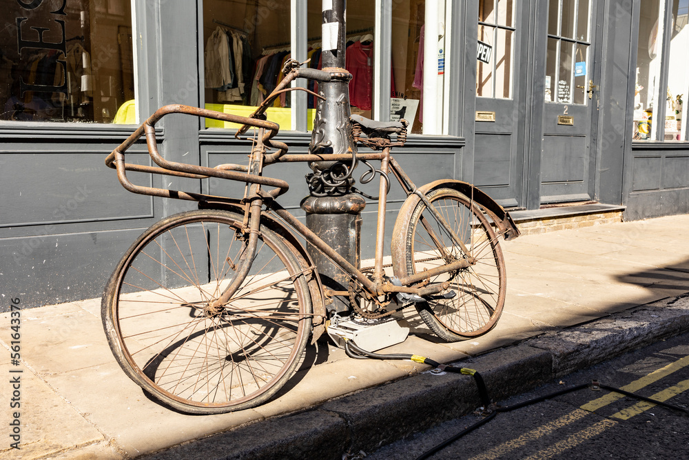 Margate, Kent, united kingdom, august 24 2022 close up on an old rusty bike with its frame completely covered with rust chained to a lampost discarded and forgotten