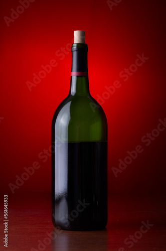 Closeup of a wine bottle on a red background