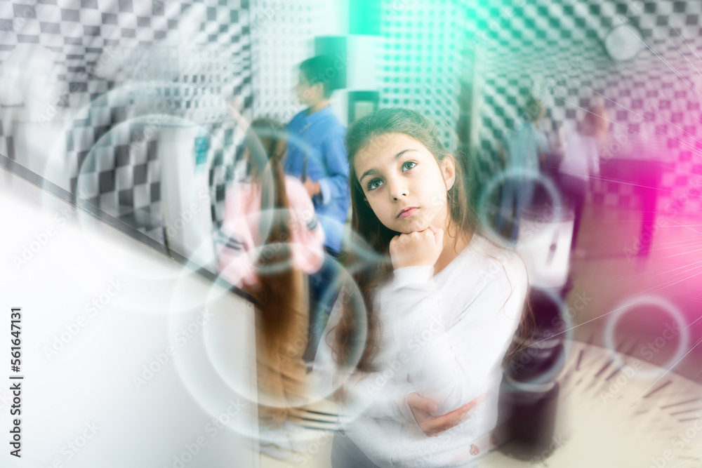 Obraz premium Pensive girl trying to find solution of conundrum to get out of quest room