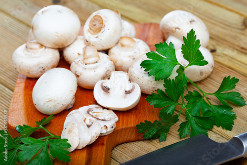 Cooking ingredients  raw mushrooms on wooden background