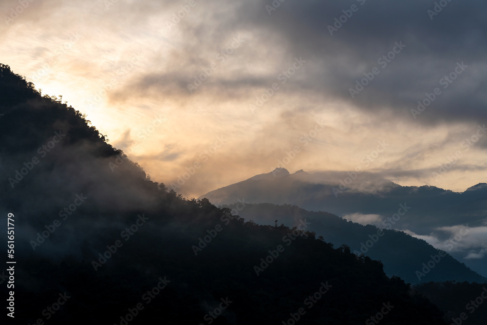 Cloud forest sunrise with Andes mountains in background, Mindo Tandayapa cloud forest, Quito region, Ecuador. Cloud forest sunrise with Andes mountains in background, Mindo Tandayapa cloud forest, Quito region, Ecuador.