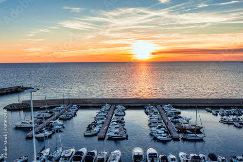 Tramonto invernale sulla spiaggia visto dal drone a campomarino di maruggio, taranto, salento, puglia, italy photo