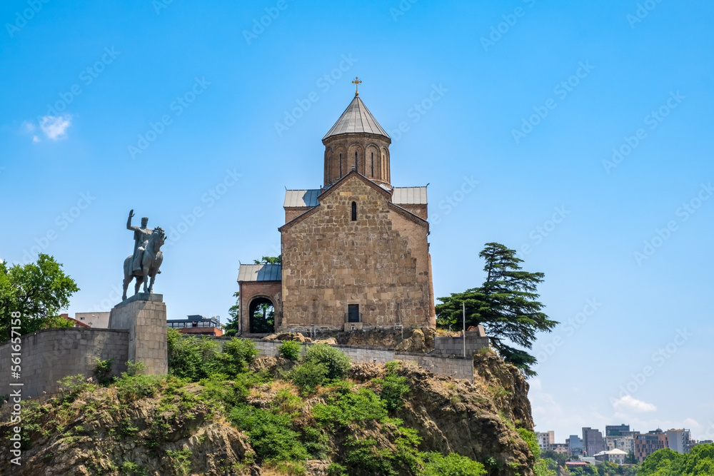 Metekhi church and monument of King Vakhtang Gorgasali on cliff in Tbilisi, Georgia. Virgin Mary Assumption Church of Metekhi is Georgian Orthodox Christian church on bank of river Kura