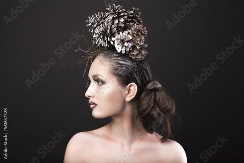 Elegant Girl in the New Year Wreath of Pine Cones