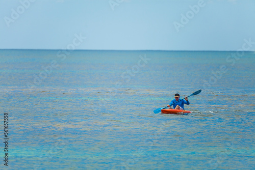 Man paddling onÂ waveskiÂ in sea, Longreach Bay, Rottnest Island, Western Australia, Australia photo