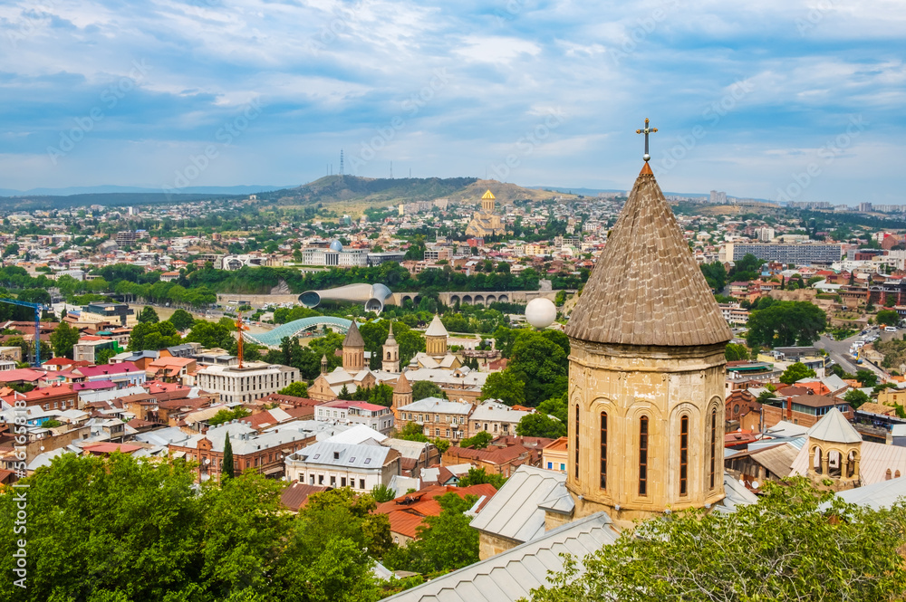 Tbilisi old town with ancient churches and modern architecture, Georgia. Cityscape with Upper Betlemi Church Cathedral, bridge of peace, Rike park. Popular tourist attractions in Tiflis