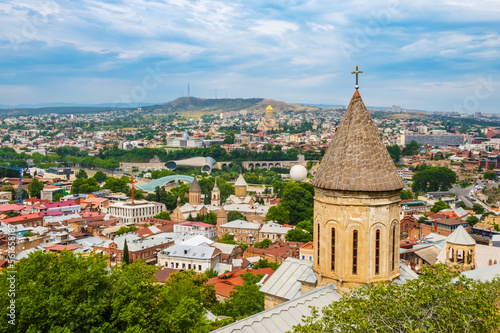 Tbilisi old town with ancient churches and modern architecture  Georgia. Cityscape with Upper Betlemi Church Cathedral  bridge of peace  Rike park. Popular tourist attractions in Tiflis
