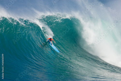 Noah Johnson surfing huge waves in Hawaii photo