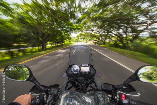 View from behind the handle bar of a driving motorbike, Pereira photo