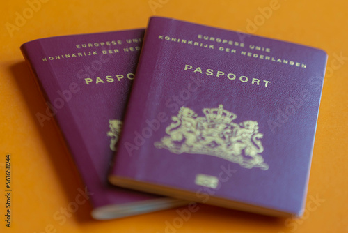 Traveling document and immigration concept, Selective focus of Dutch passport (Nederlands paspoort) are issued to citizens of the Kingdom of the Netherlands for the purpose of international travel.  photo