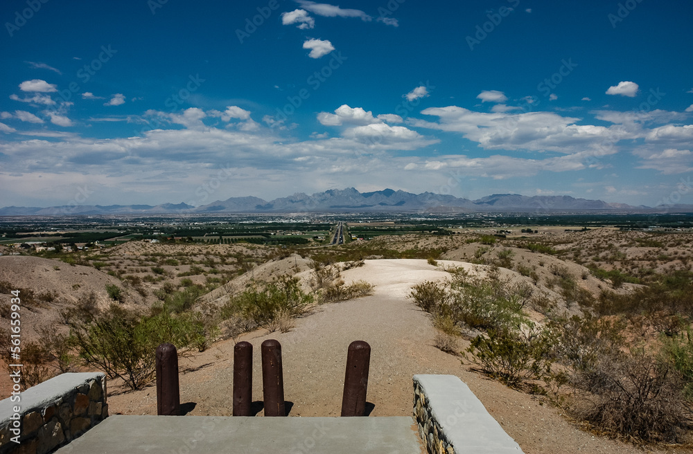 A Hiking and Biking Trail in the Desert Mountains with an Aerial View of the Town