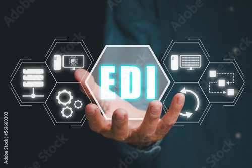 EDI, Electronic data interchange concept, Person hand holding Electronic data interchange icon on virtual screen. photo