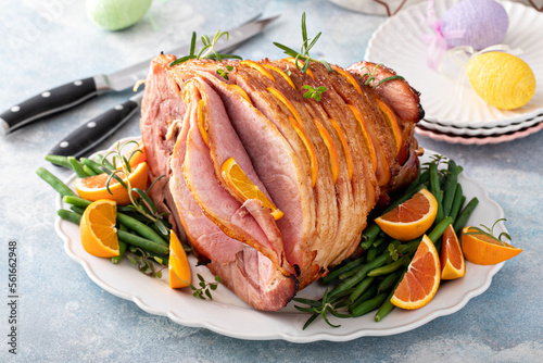 Canvas Print Easter ham stuffed with orange slices, spiral sliced glazed ham