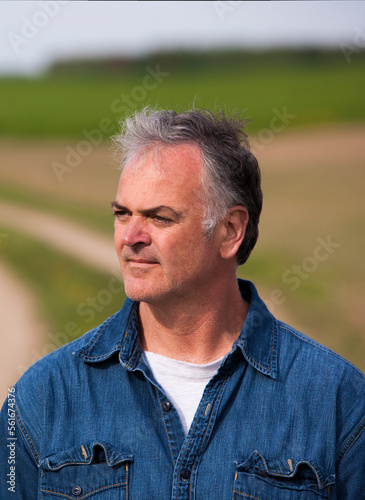 Close up portrait of handsome mature man outdoors.