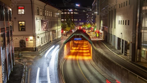 Busy night traffic in the center of Oslo timelapse tunnel entrance photo