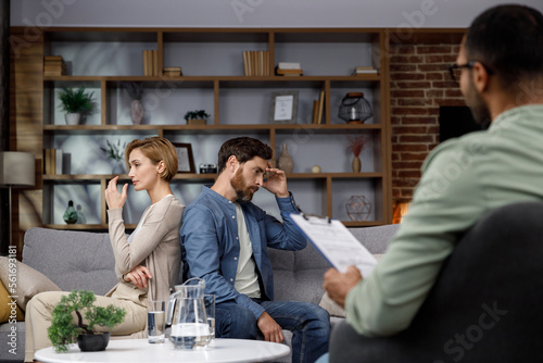 A quarrel between a husband and wife at a psychotherapist's appointment. A visit to a family psychologist for a married couple. An African-American doctor consults an unhappy couple.