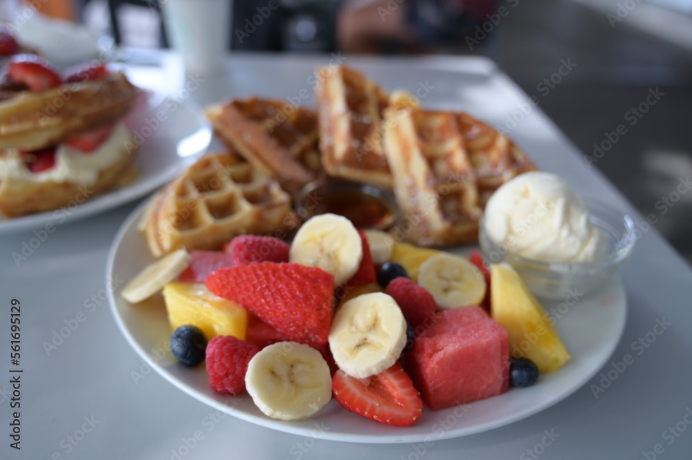 A lot of fruits on the waffle A lot of fruits on the waffle