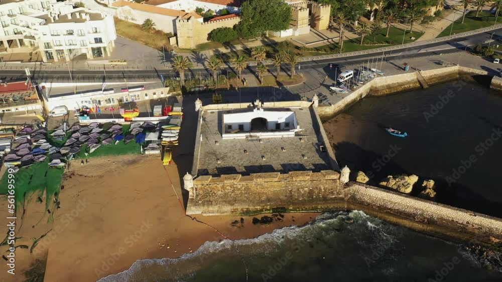 The city center of Lagos and its fortifications, in Europe, in Portugal, in the Algarve, towards Albufeira, in summer, on a sunny day. The city center of Lagos and its fortifications, in Europe, in Portugal, in the Algarve, towards Albufeira, in summer, on a sunny day.