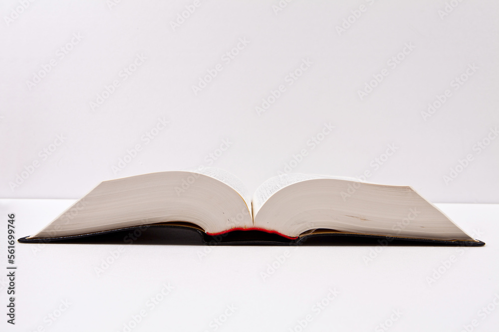 Open book and school supplies with a path on a white background. Open book and school supplies with a path on a white background.