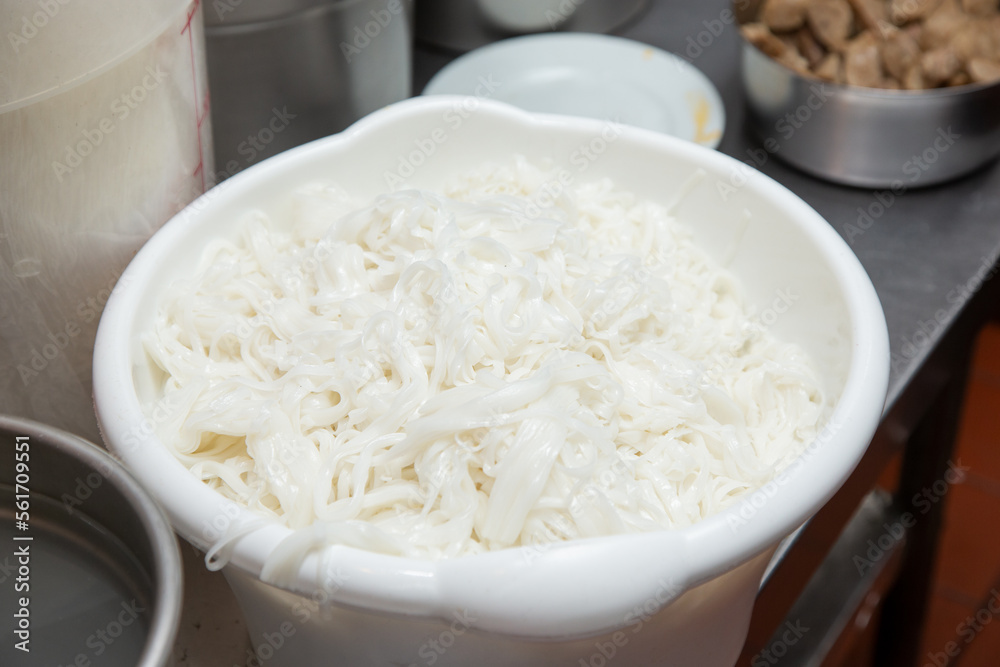A view of a large bowl of freshly made vermicelli noodles, used for Vietnamese pho.