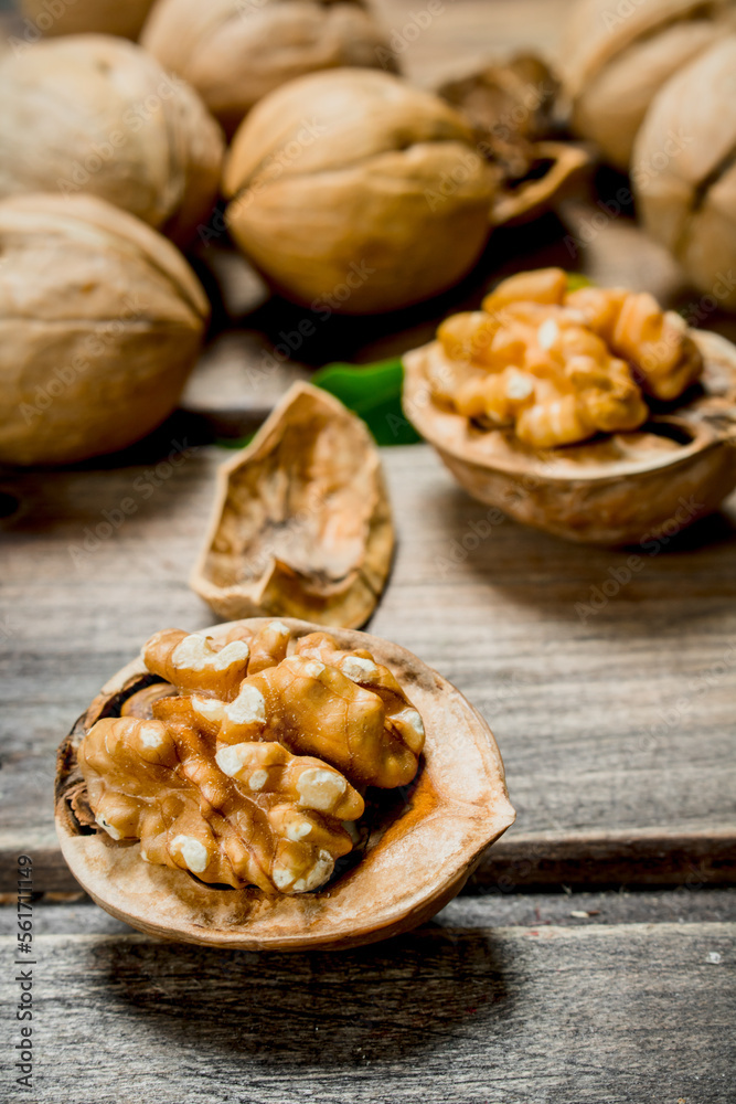 Shelled walnut with green leaves. Shelled walnut with green leaves.