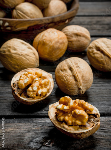 Peeled walnut on wooden background. photo
