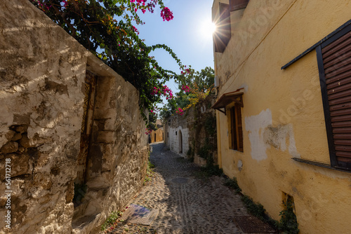 Fototapeta Naklejka Na Ścianę i Meble -  Streets and Residential Homes in the historic Old Town of Rhodes, Greece. Sunny Morning.