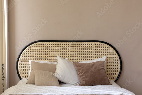 Photos Cozy rattan oval round headboard with pillows in white beige sand and natural brown