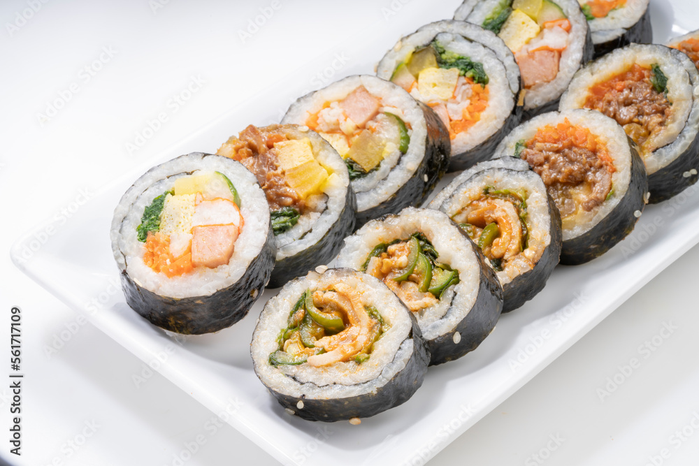 Korean Seaweed Rice Rolls or Kimbap Korean dish made from cooked rice vegetables, meats that are rolled in seaweed, Bulgogi Kimbap and pork bbq Kimbap Korean food. Korean Seaweed Rice Rolls or Kimbap Korean dish made from cooked rice vegetables, meats that are rolled in seaweed, Bulgogi Kimbap and pork bbq Kimbap Korean food.