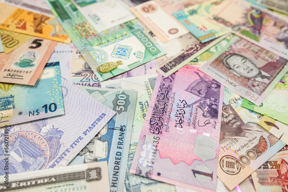 Various African banknotes stacked on top of each other forming a money background. Various African banknotes stacked on top of each other forming a money background.