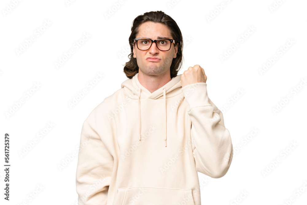 Young caucasian man isolated on green chroma background with unhappy expression