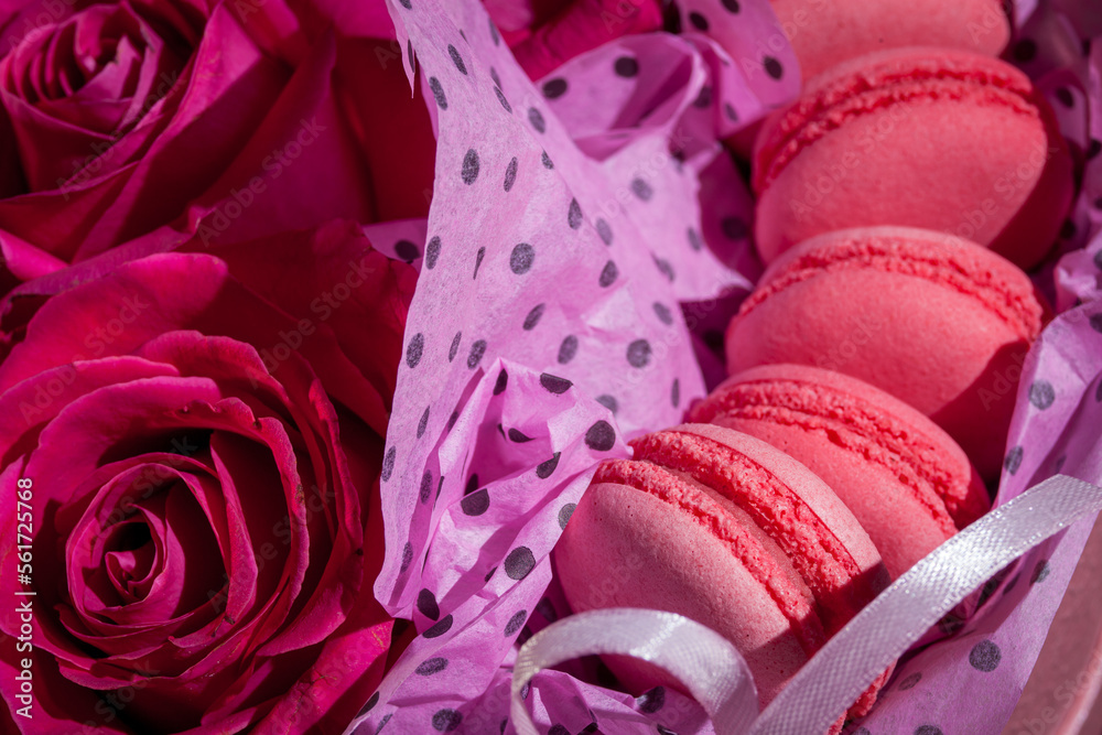 Pink roses and pink macaroons. Background for valentines and woman day. Wedding decoration Pink roses and pink macaroons. Background for valentines and woman day. Wedding decoration