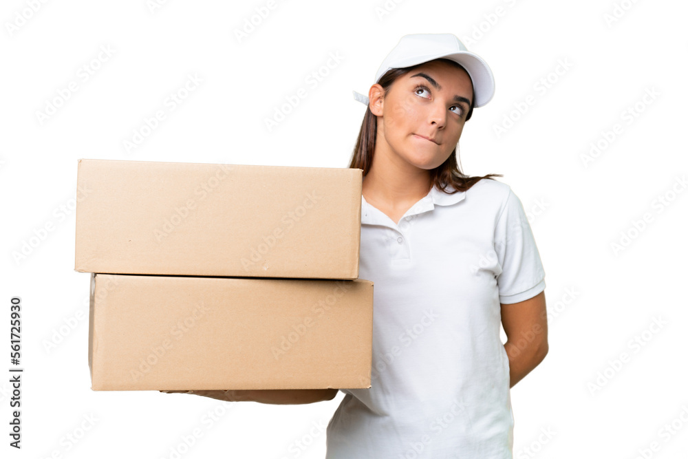 Delivery caucasian woman holding boxes isolated on green chroma background and looking up Delivery caucasian woman holding boxes isolated on green chroma background and looking up