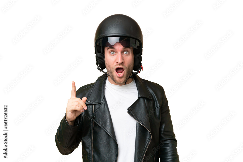 Young caucasian man with a motorcycle helmet isolated on green chroma background intending to realizes the solution while lifting a finger up Young caucasian man with a motorcycle helmet isolated on green chroma background intending to realizes the solution while lifting a finger up