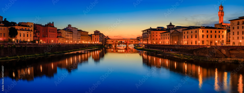 Famous Ponte Vecchio bridge and Palazzo Vecchio at sunset, Florence, Italy