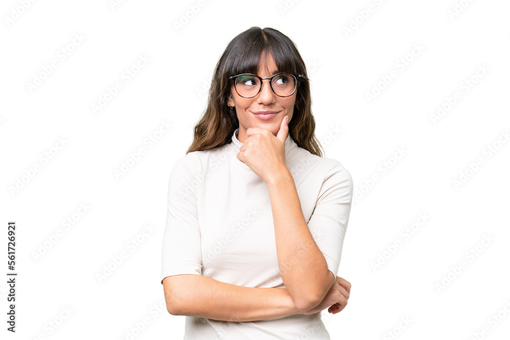 Young caucasian woman over isolated background thinking an idea while looking up Young caucasian woman over isolated background thinking an idea while looking up