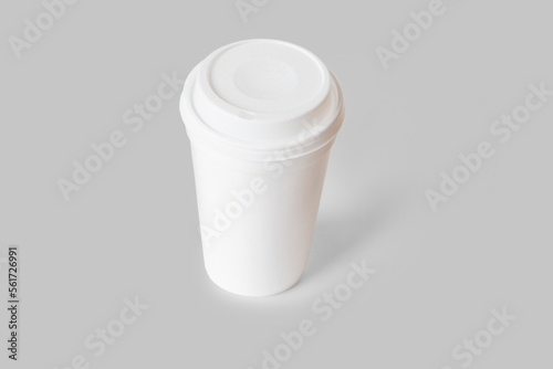 Empty blank white disposable coffee cup mockup isolated on a background. 3d rendering.