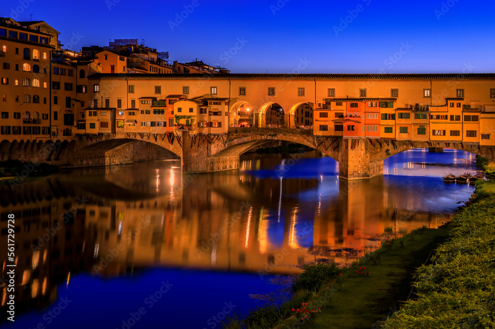 Ponte Vecchio bridge with silversmith shops on Arno at sunset, Florence, Italy