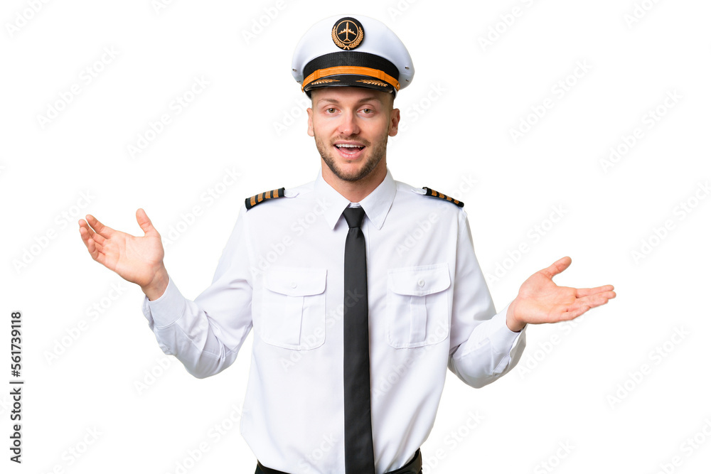 Airplane pilot man over isolated background with shocked facial expression Airplane pilot man over isolated background with shocked facial expression
