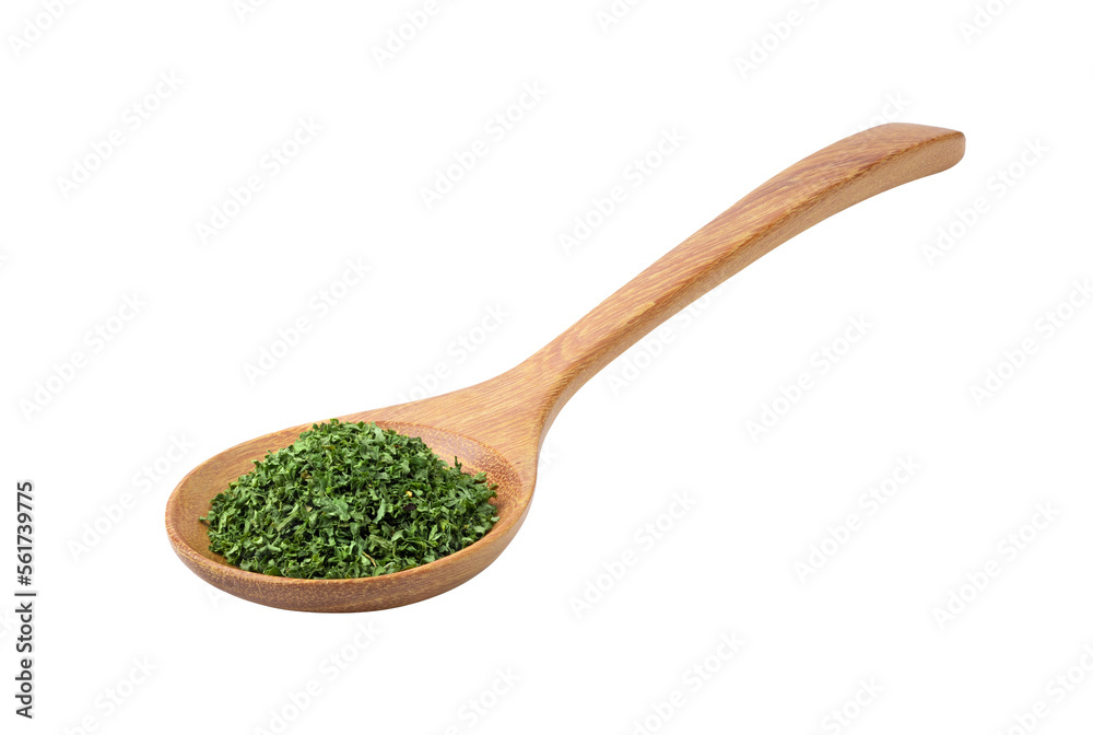 Dried parsley in wood spoon on transparent png Dried parsley in wood spoon on transparent png