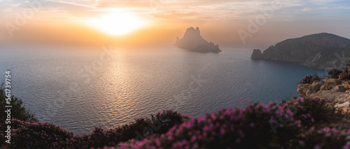 Spain, Balearic Islands, Panoramic view of Es Vedra island seen from clifftop at sunset photo