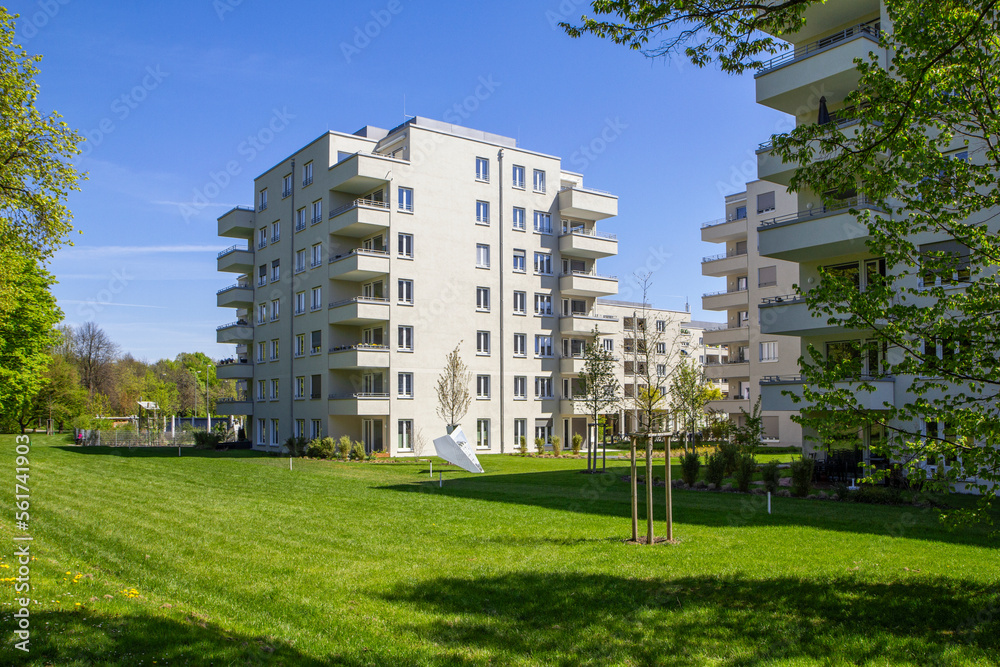 Modern apartment buildings and garden in residential area Modern apartment buildings and garden in residential area
