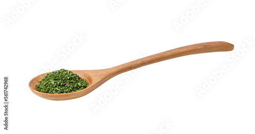 Dried parsley in wood spoon on a white background