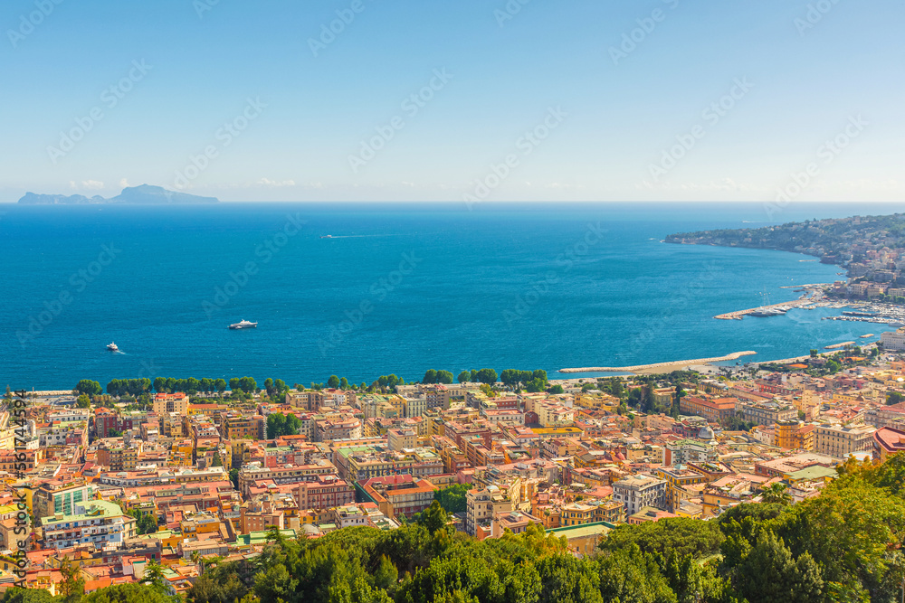 Aerial view of Naples city on the coast of Mediterranean sea, Campania, Italy. Cityscape of Napoli