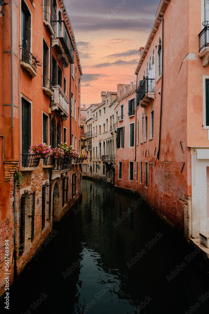 Venice's characteristic canal at dawn, without people and boats