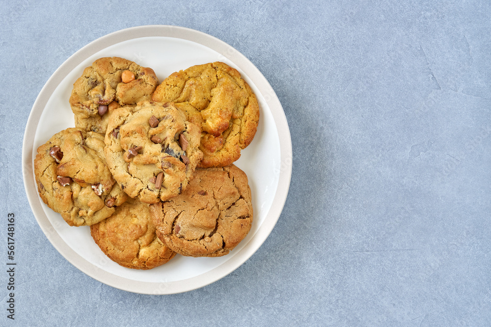 Assorted cookies with dark and white chocolate in a plate. Top view Assorted cookies with dark and white chocolate in a plate. Top view