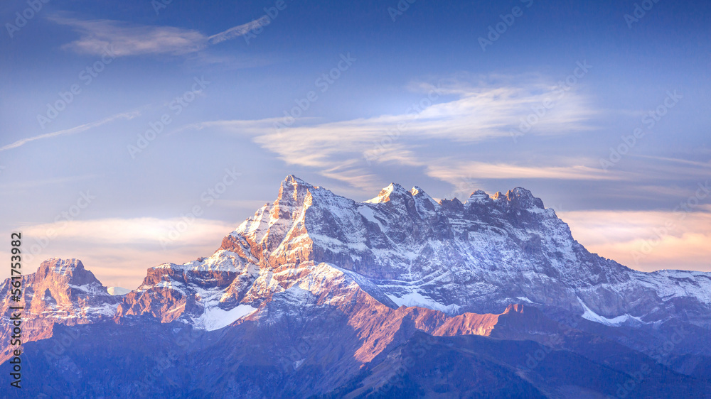 Sinrise or sunset panoramic banner view of the Dents du Midi in the Swiss Alps, canton Vaud, Switzerland