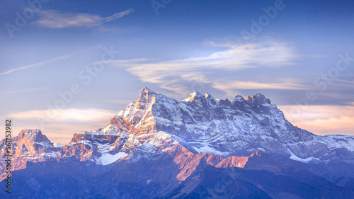 Sinrise or sunset panoramic banner view of the Dents du Midi in the Swiss Alps  canton Vaud  Switzerland