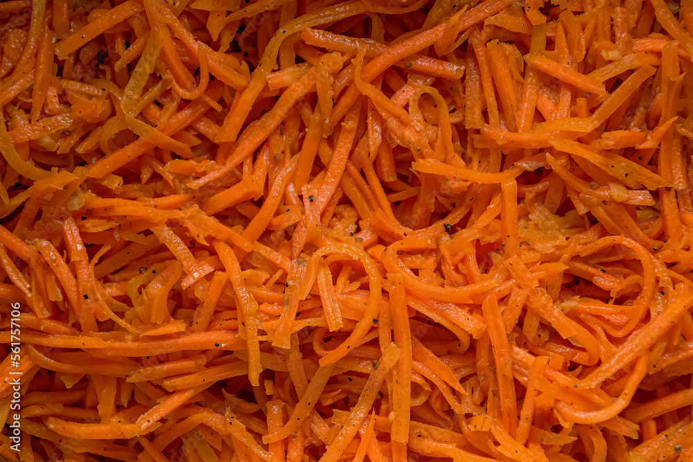 Close-up of Korean carrot salad with hot spices. View from above Close-up of Korean carrot salad with hot spices. View from above